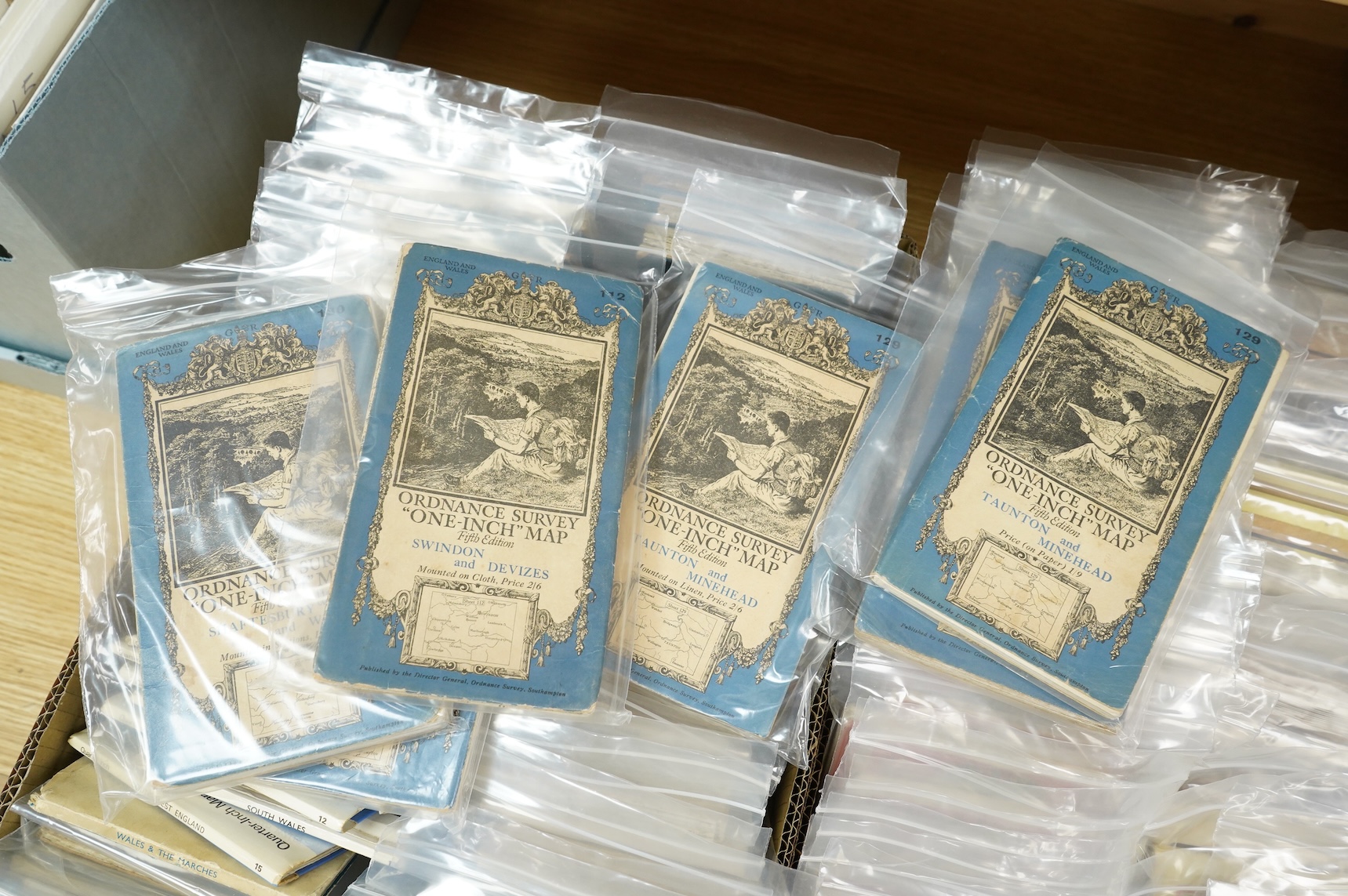 A collection of Ordnance Survey maps including Explorer series 1:25,000, Seventh Series One Inch, together with miscellaneous touring and historic editions (3 boxes)